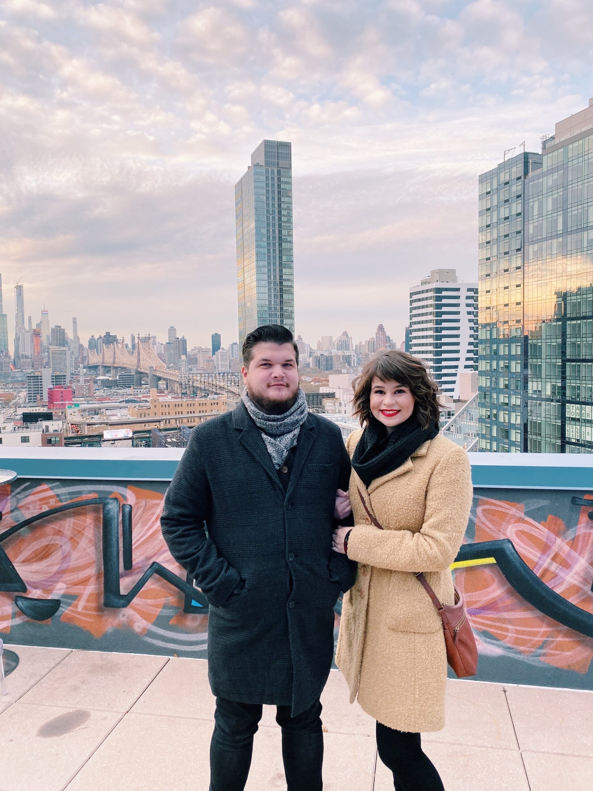 couple against the New York skyline - paying off debt as a couple