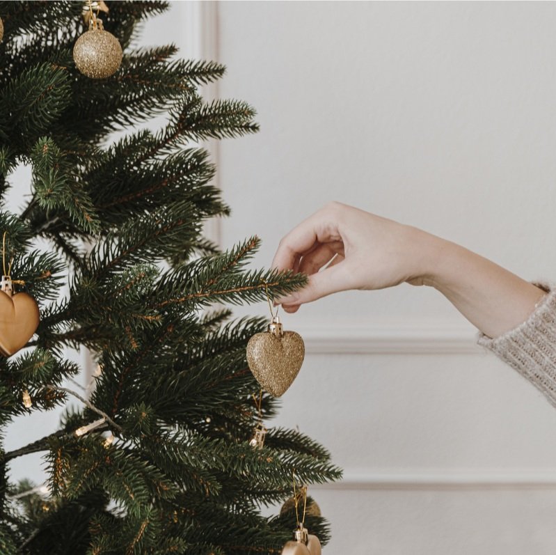 hanging-christmas-ornament-on-christmas-tree